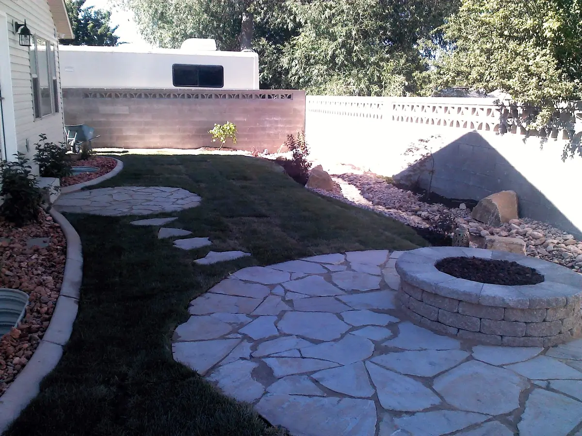 Flagstone patio, round fire pit and stepping stones