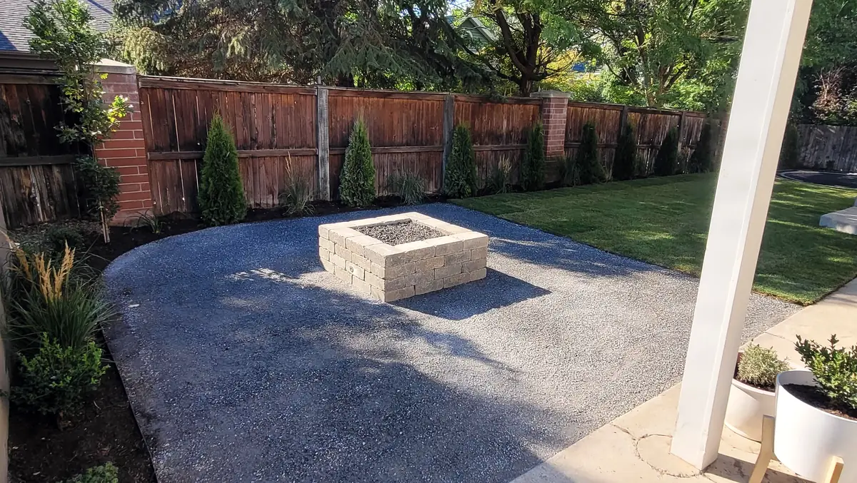 Gas fire pit on an exposed-aggregate patio