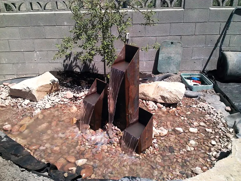 Steel water columns being set in rock