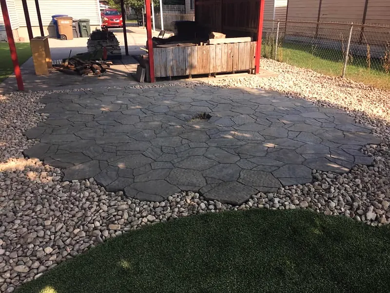 Flagstone patio with a river-rock border