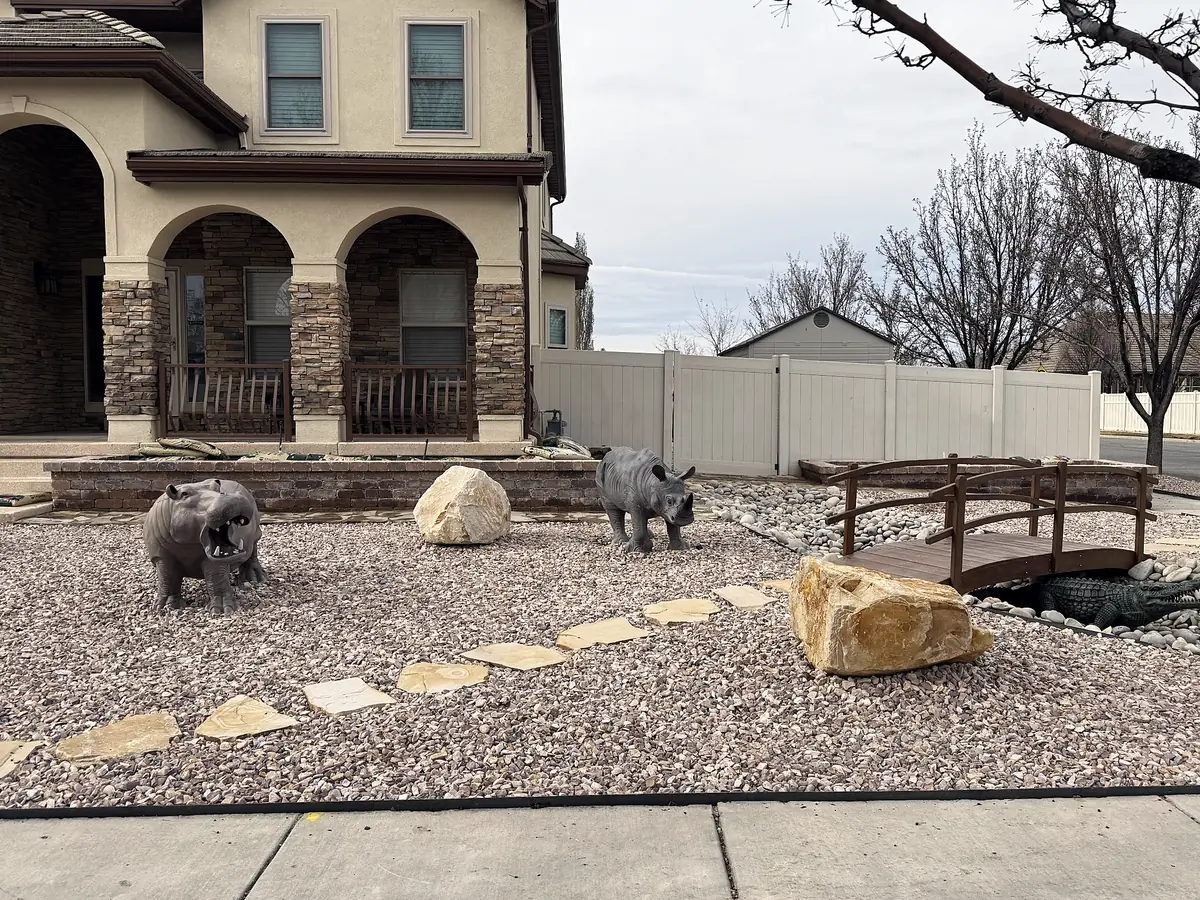 Xeriscaped front yard with a bridge