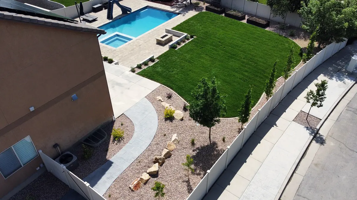 Backyard lawn and rock beds from above