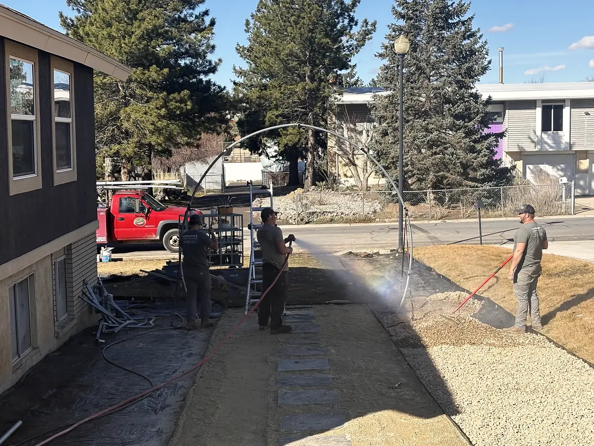 Crew watering in a new pathway