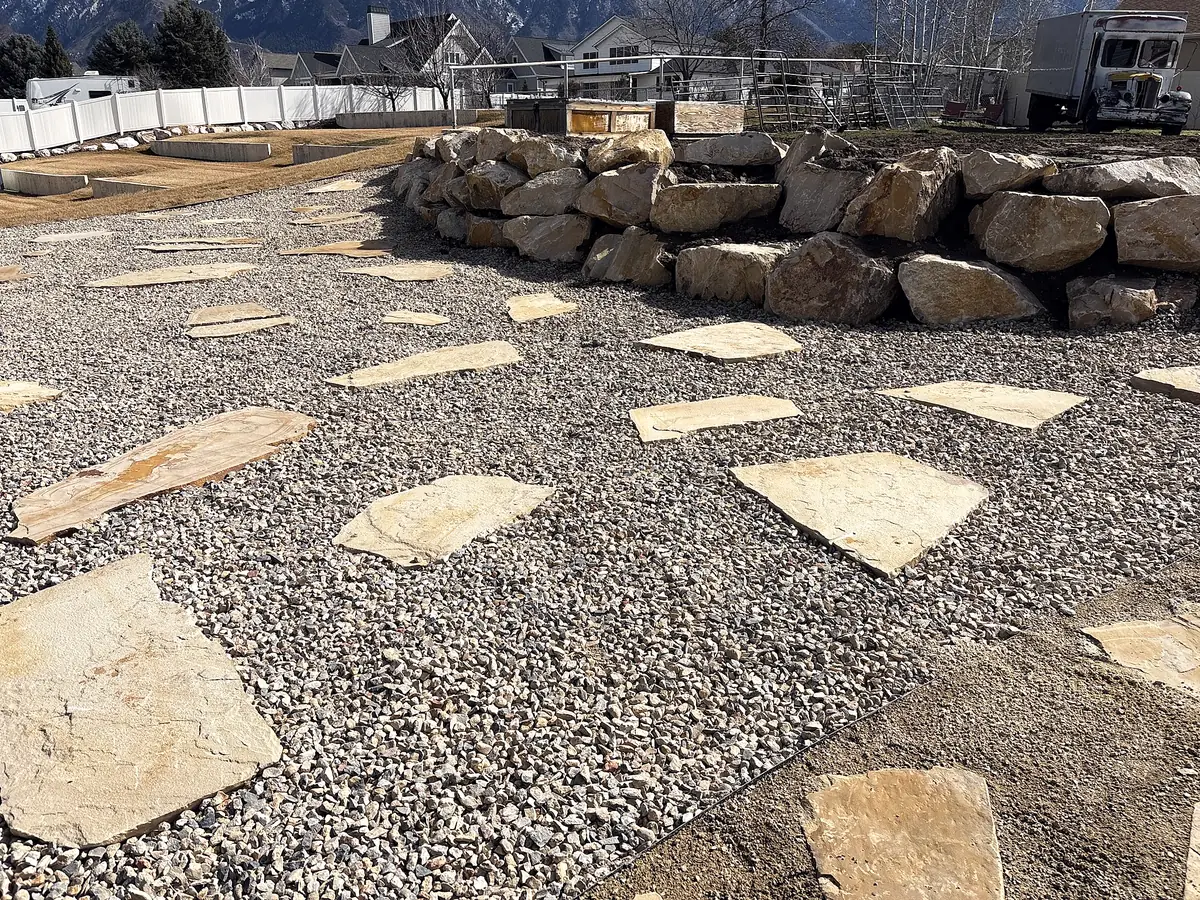 Flagstone path and boulder wall