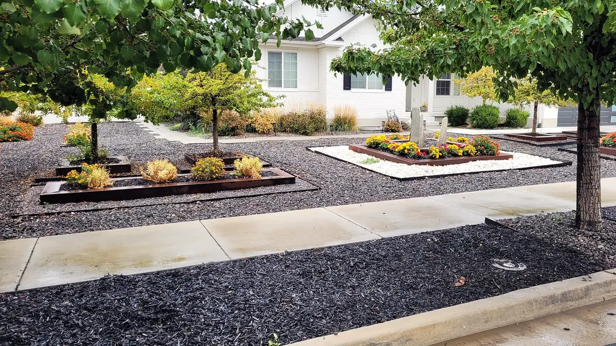 Row of steel planters with seasonal flowers