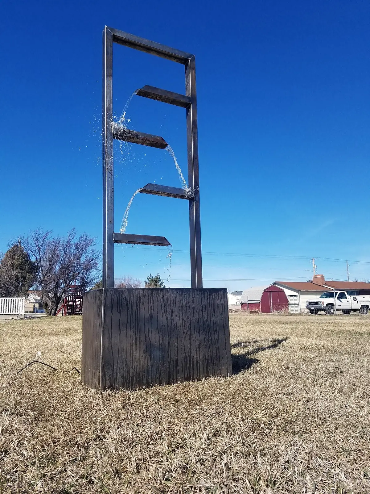 Tall custom steel water feature