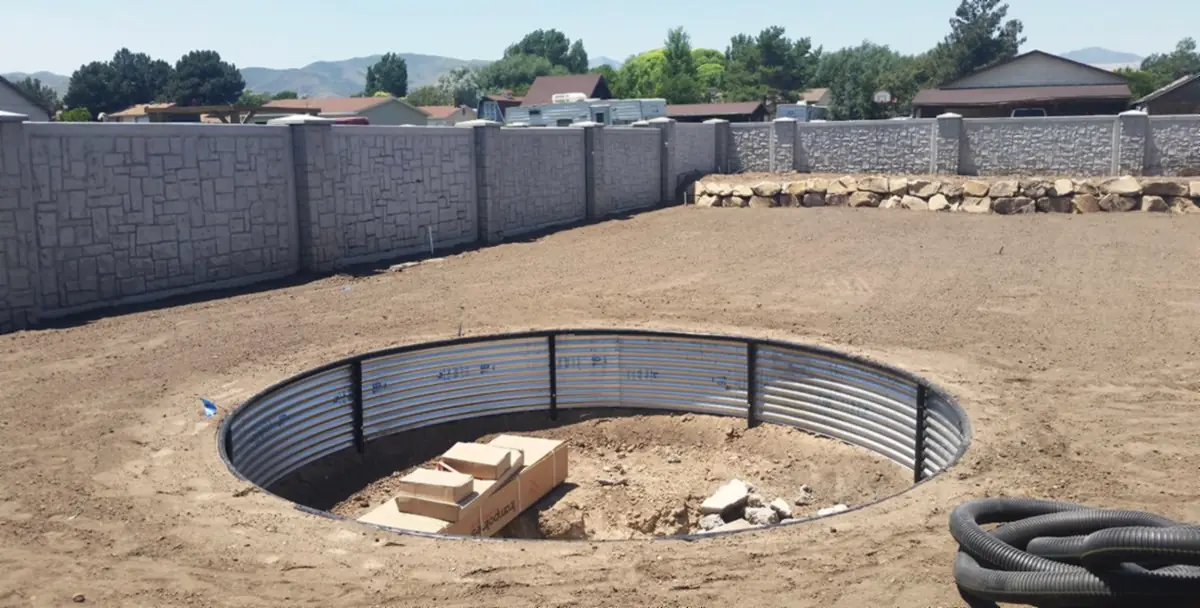 Trampoline pit: retaining ring and drain