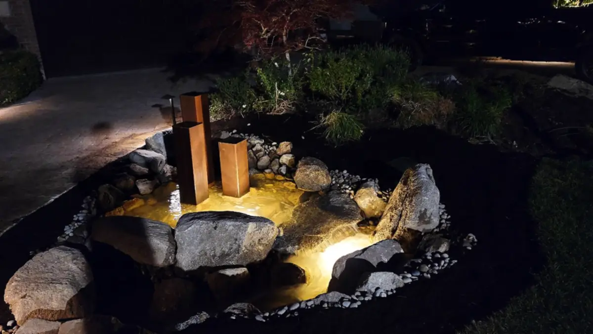 Lit water feature with steel columns