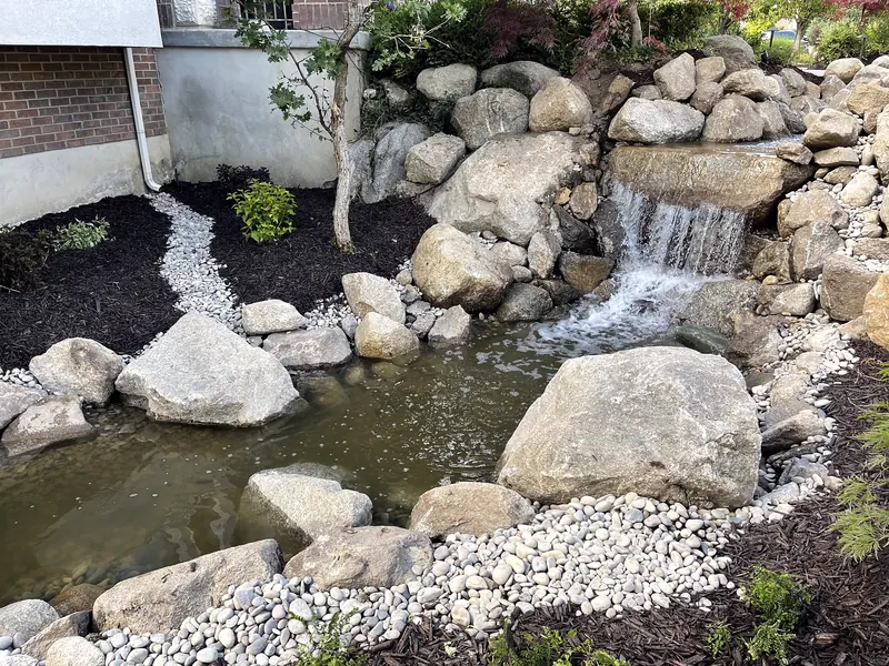 Boulder waterfall and pond