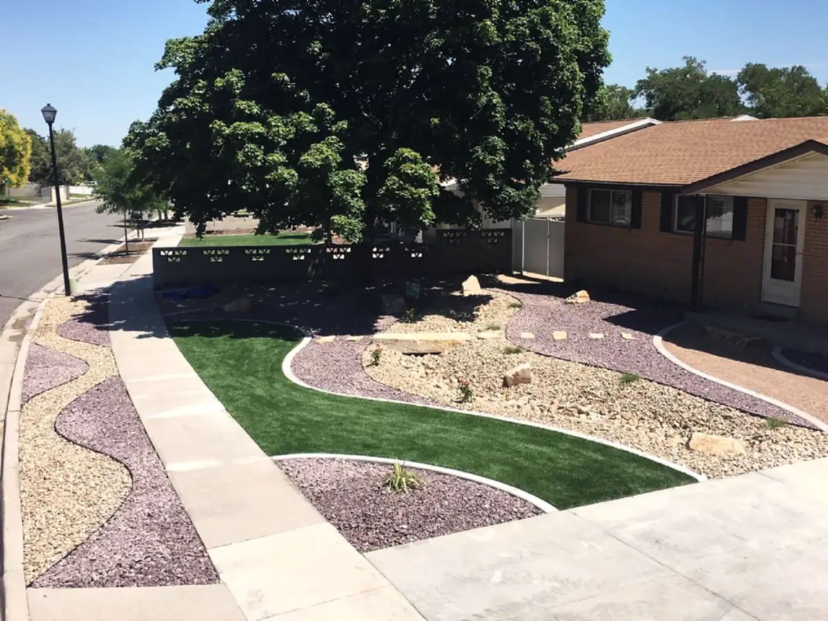 Rock and lawn front yard, curved borders