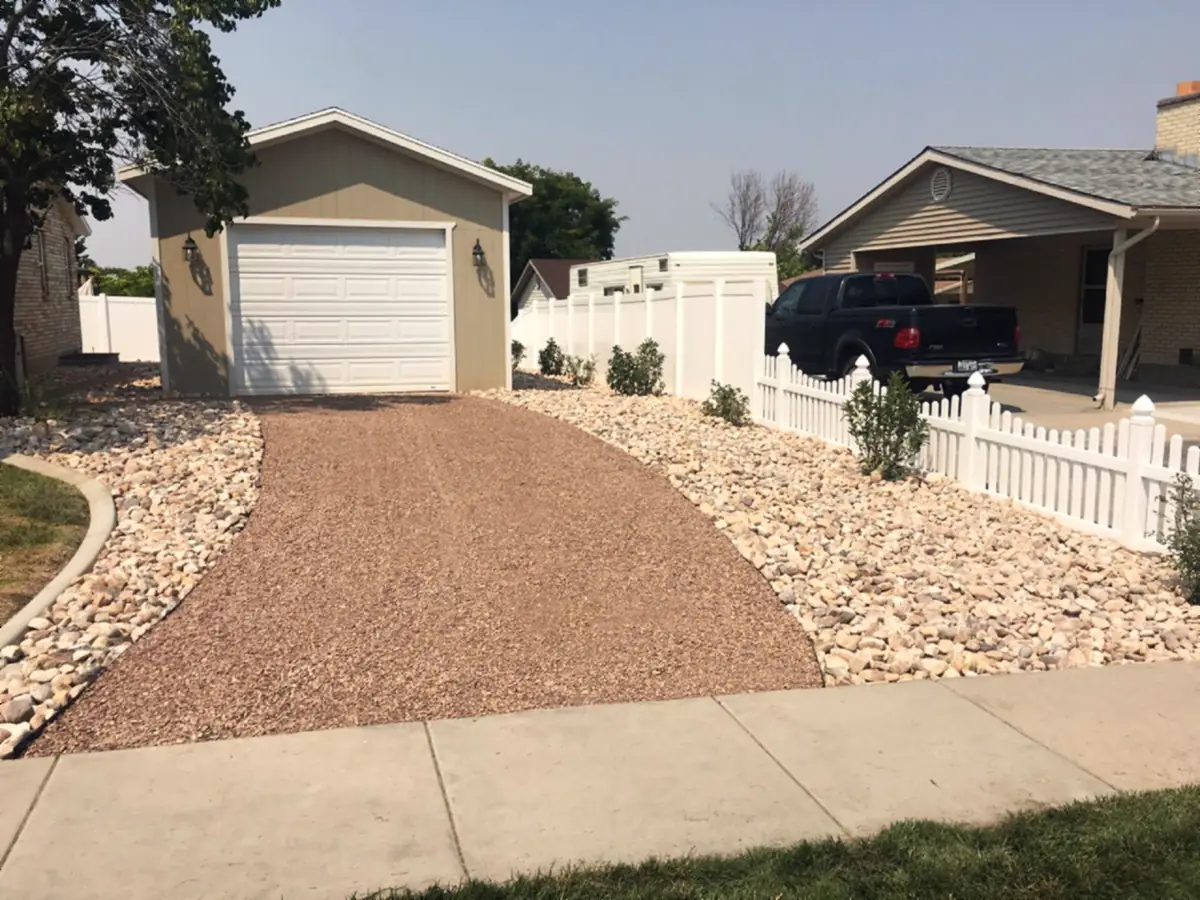 Gravel parking pad with cobble borders