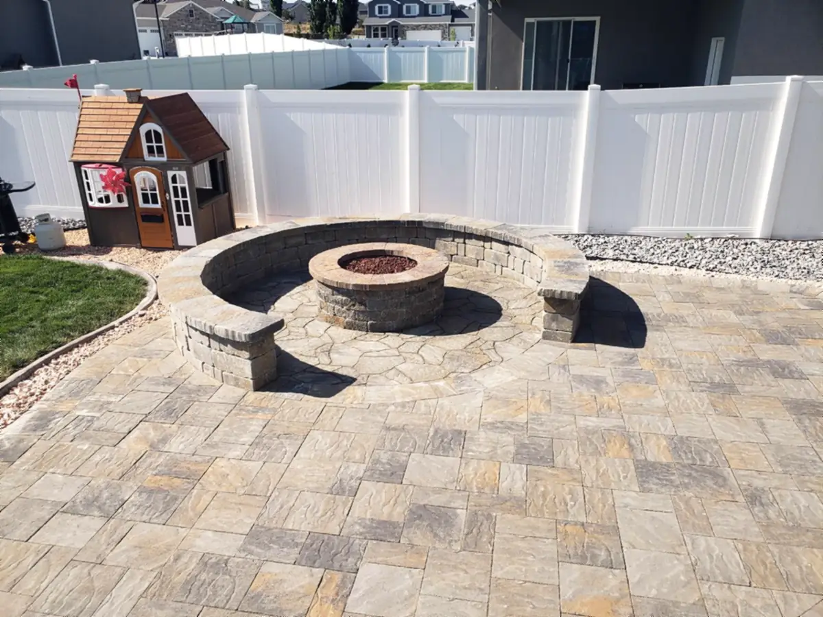 Paver patio with fire pit and seat wall