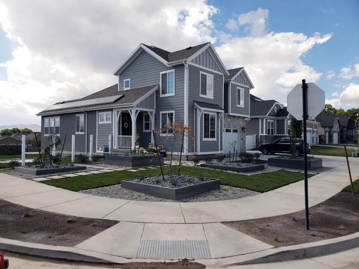 Corner lot: steel planters, sod and rock