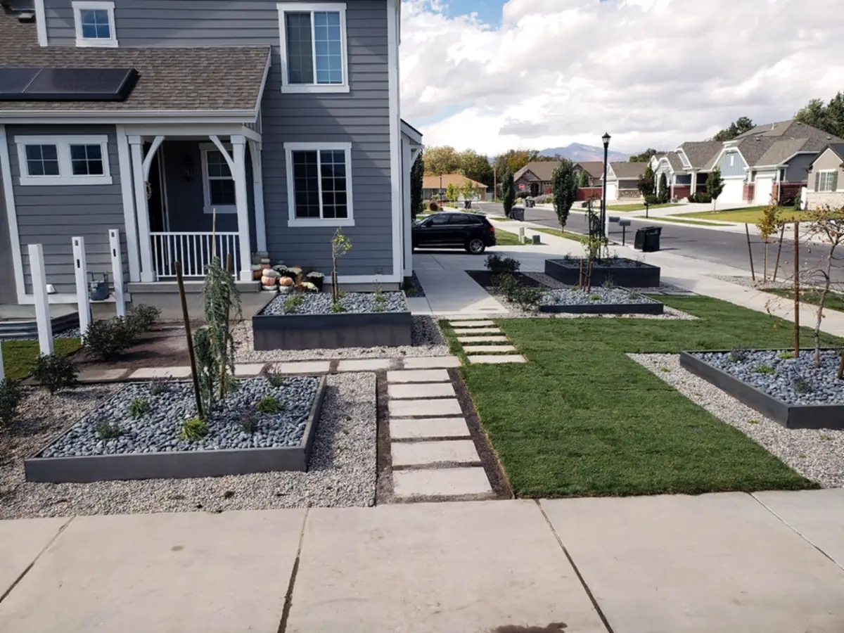 Corner-lot front yard with steel planters