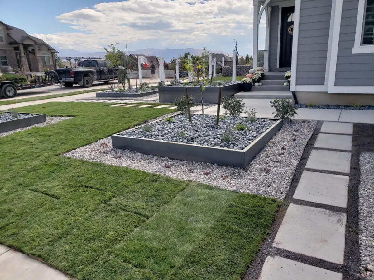 Steel planter beside a new lawn